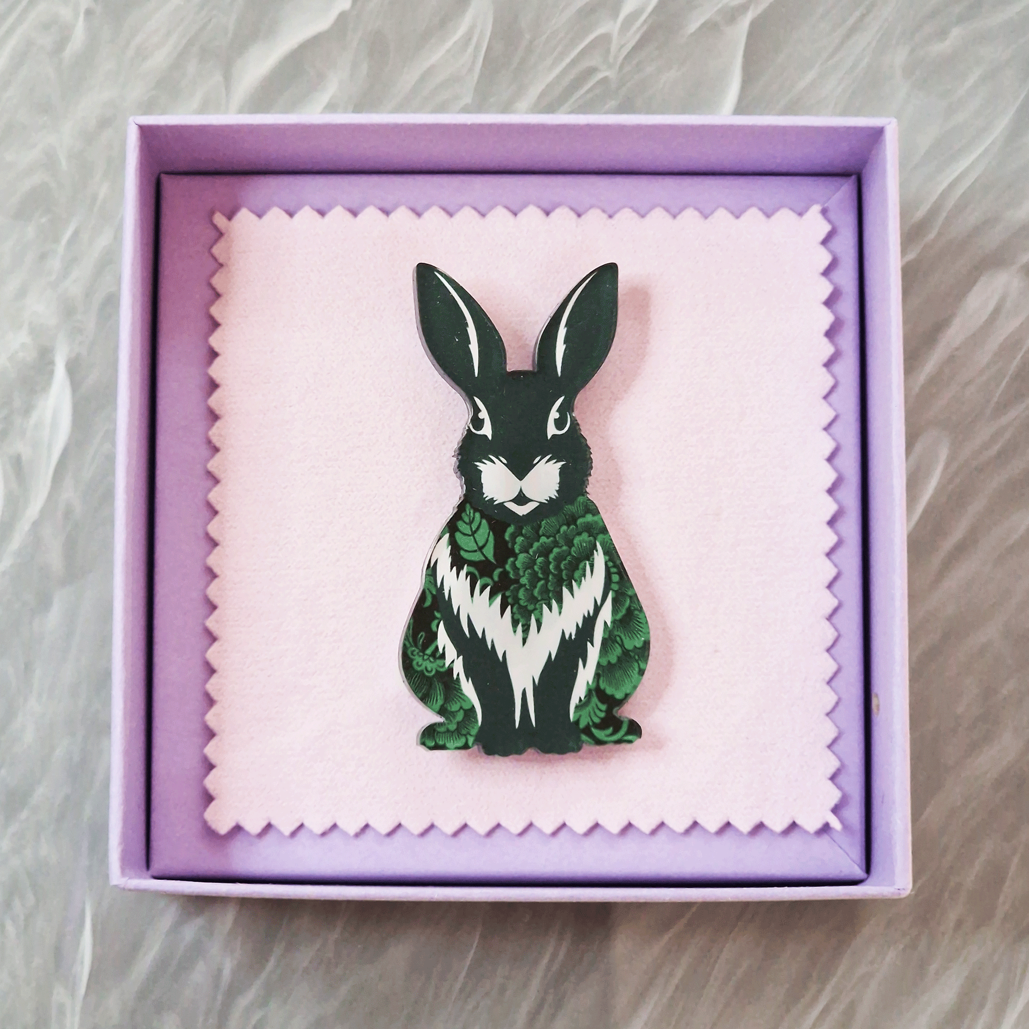 Green rabbit acrylic brooch with a vintage floral pattern, secure roll pin fastening and presented in a lilac gift box with cleaning cloth.