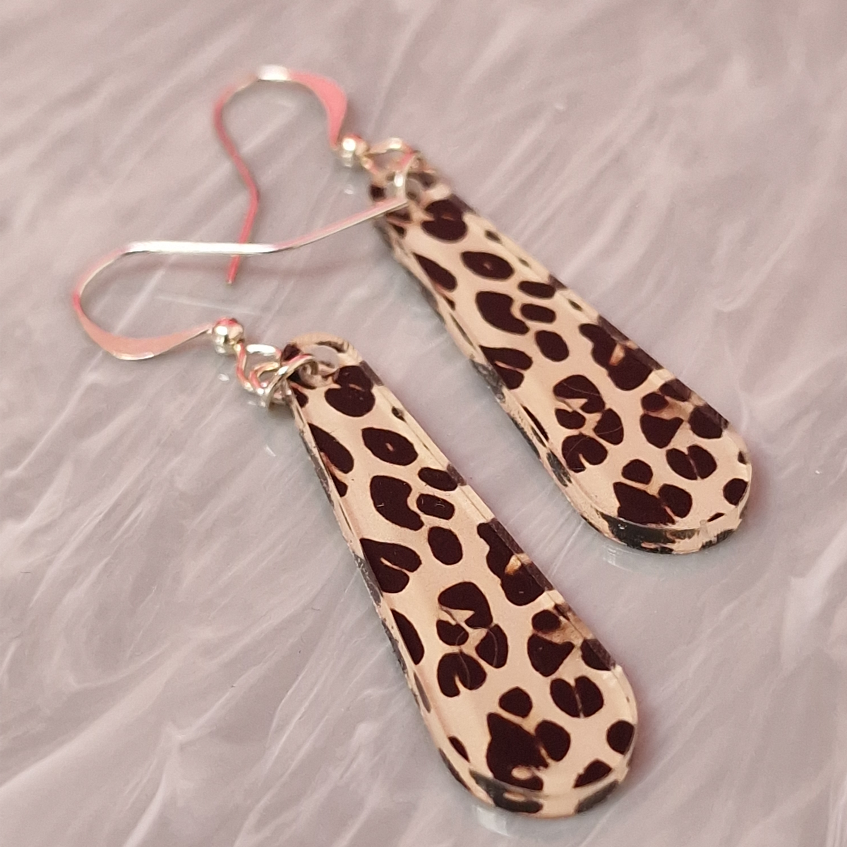 Beige, brown and black printed acrylic leopard print drop earrings with silver plated hook