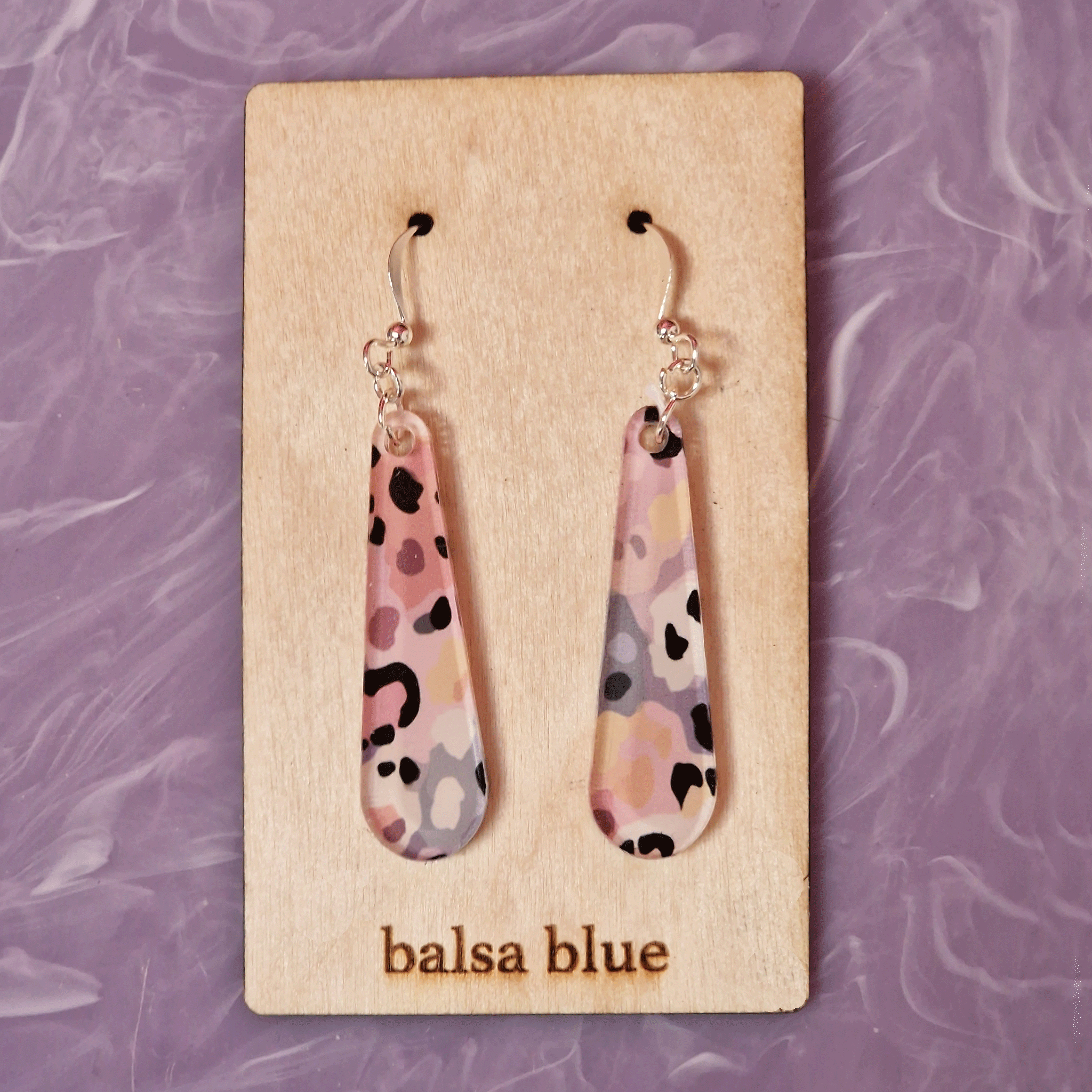 Pale pink, purple, lilac, beige and black printed acrylic leopard print drop earrings with silver plated hook